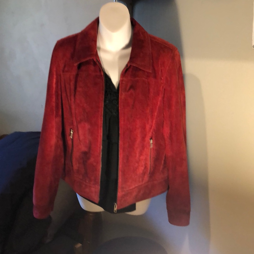Vintage red leather/suede jacket. Has a tiny flaw on back shoulder area.